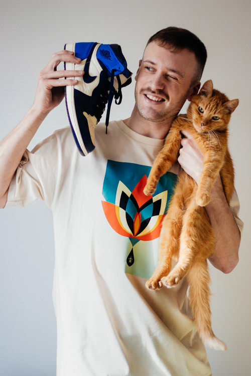 Dima Shuganov with cat and a snicker