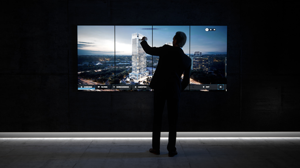 Man interacts with real estate presentation on a touch screen