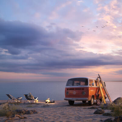 Red vintage Volkswagen van escaping to the ocean sunset beach