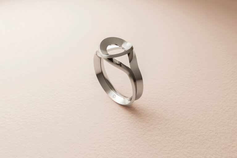 3D product visualization of engraved silver ring of complex shape on a beige paper background