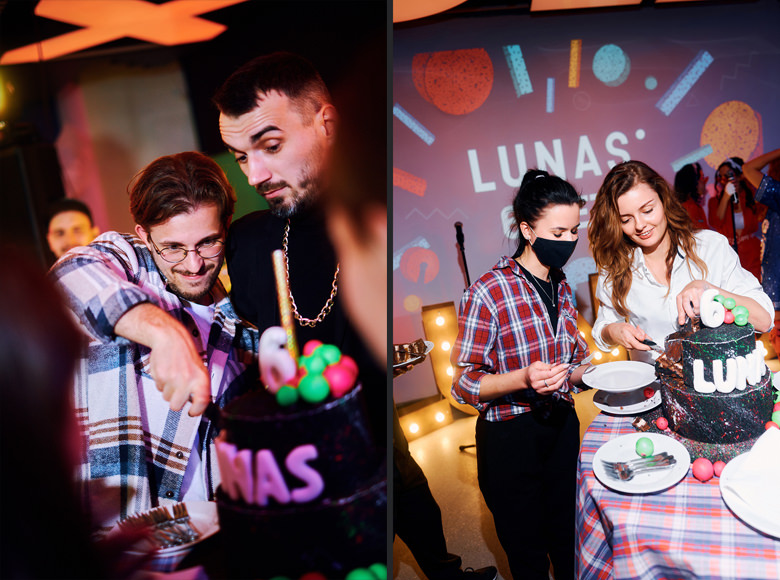 Lunas team members cutting the anniversary cake