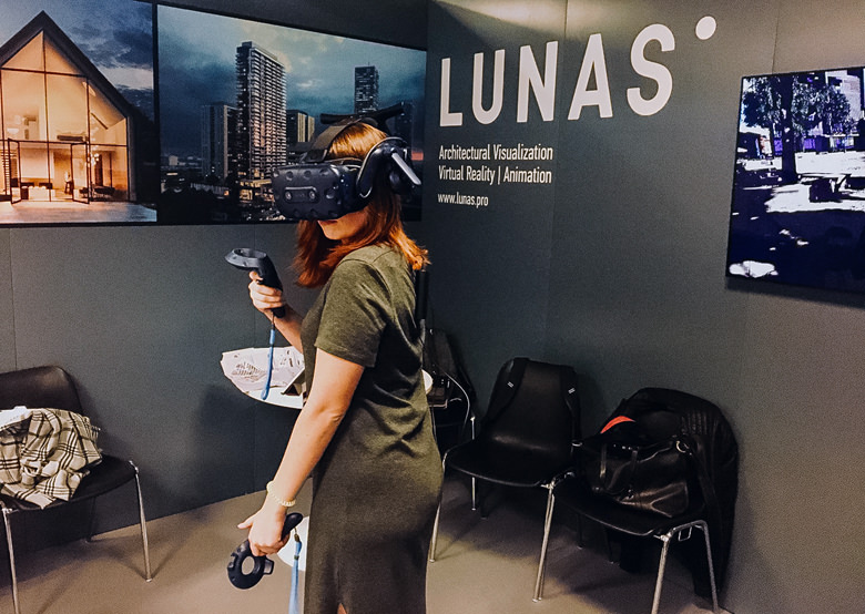 Client at our real estate show boot wearing VR helmet for interactive presentation softwareh 